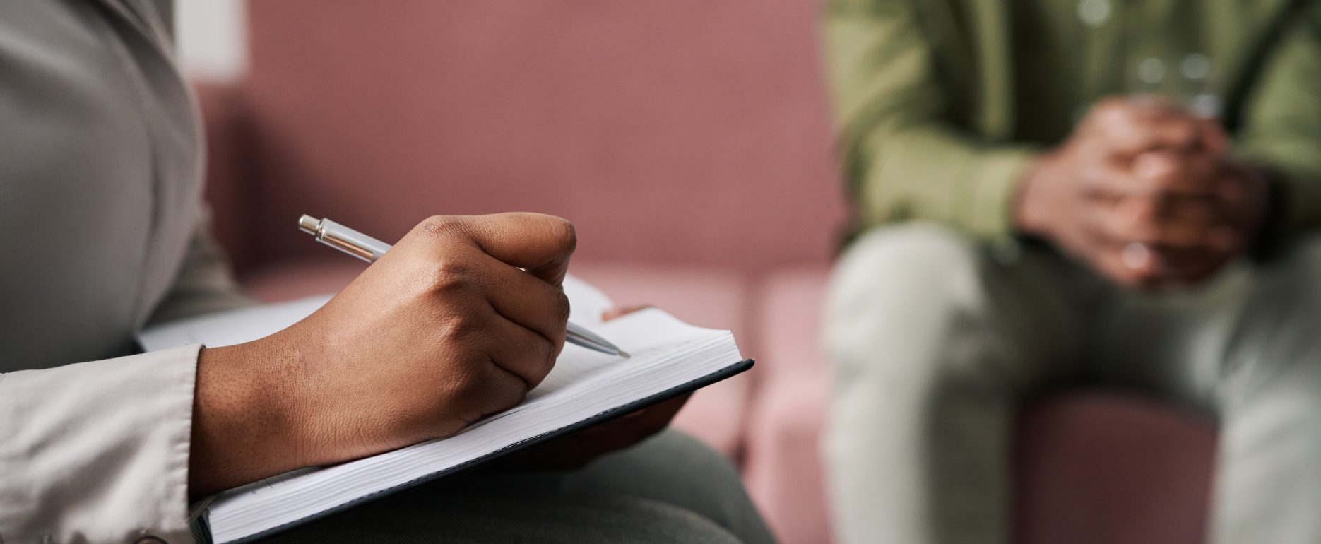 hand young female psychoanalyst making notes notebook session - Cn2r